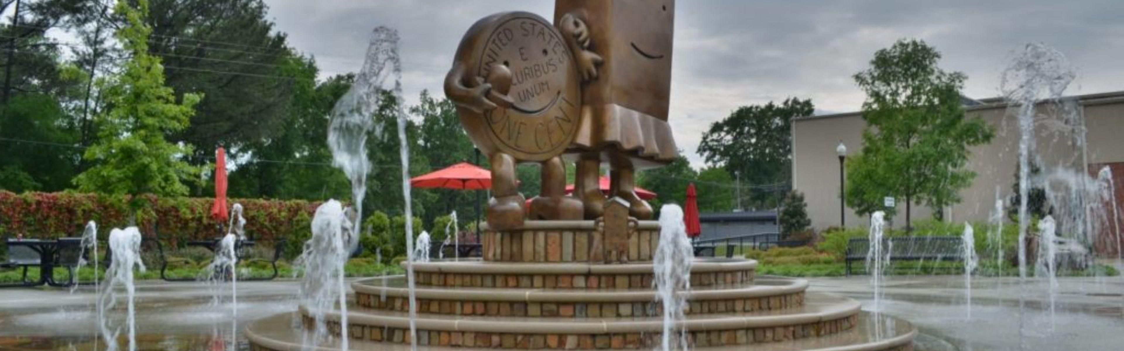 The Pennies sculpture and splashpad in Fulton
